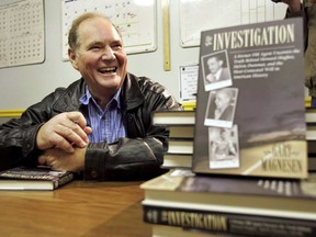 In this Nov. 10, 2005 file photo, Melvin Dummar smiles after signing copies of a book that Gary Magnesen had written about Dummar's claims that Howard Hughes left him a portion of the Hughes estate.