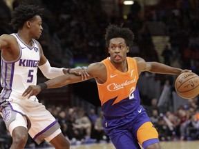 Cleveland Cavaliers' Collin Sexton (2) drives to the basket against Sacramento Kings' De'Aaron Fox (5) in the first half of an NBA basketball game, Friday, Dec. 7, 2018, in Cleveland.