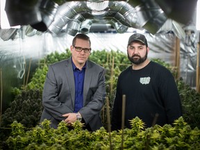 Yan Boissonneault, left, and James Gallagher, licensed medical marijuana growers, pose for a photograph at a legal medical grow-op they oversee, in Mission, B.C., on Wednesday December 5, 2018. They operate a handful of small legal medical grow-ops in British Columbia and are among the "craft" producers who hope to use their skills in the fledgling recreational market by getting a new licence for microcultivation.