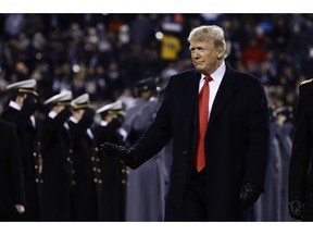 President Donald Trump crosses the field after the first half of an NCAA college football game between the Army and the Navy, Saturday, Dec. 8, 2018, in Philadelphia.