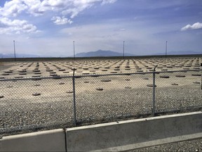 FILE - In this May 11, 2015 file photo, nuclear waste is stored in underground containers at the Idaho National Laboratory near Idaho Falls, Idaho. Federal officials will shut down a nuclear waste treatment project at the site after determining it would not be economically feasible to bring in radioactive waste from other states. The U.S. Department of Energy in documents made public this week says the Advanced Mixed Waste Treatment Project that employs 650 workers will end next year. Officials say workers are wrapping up processing radioactive waste at the department's 890-square-mile (2,300-square-kilometer) site that includes the Idaho National Laboratory.