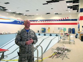 Air Force Col. Michael Staples shows damage from the powerful Nov. 30 earthquake, at Joint Base Elmendorf-Richardson Friday, Dec. 7, 2018, in Anchorage, Alaska. The magnitude 7.0 earthquake caused multiple problems around the base, including damage to steel frameworks, ceilings, and sprinkler and heating systems, but no catastrophic damage.