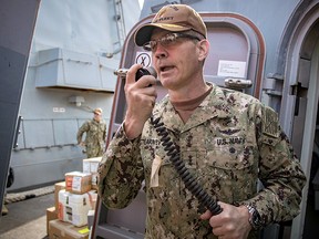 Vice Admiral Scott Stearney welcomes the crew of the guided-missile destroyer USS Jason Dunham (DDG 109) to Manama, Bahrain on October 24, 2018.