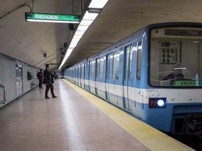 A subway train is seen pulling into a station Thursday, March 24, 2016 in Montreal. Jean Dumontier, an architect who helped design Montreal’s subway and adorned its walls with his art, has died in his early 80s.