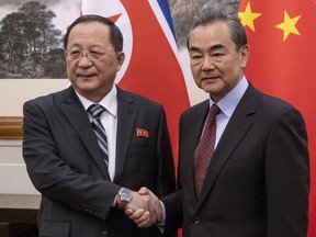 North Korean Foreign Minister Ri Yong Ho, left meets China's Foreign Minister Wang Yi at the Diaoyutai State Guesthouse in Beijing  Friday, Dec. 7, 2018.
