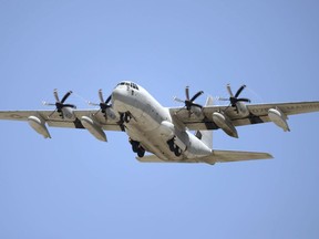 This July, 2014, photo shows a U.S. Marine Corps' KC-130 refueling plane in Ginowan city, Okinawa, southwestern Japan.  A search is under way off for crew members from two Marine Corps planes, a F/A-18 and a refueling plane, involved in what officials called a "mishap" off the coast of Japan, Thursday, Dec. 6, 2018.