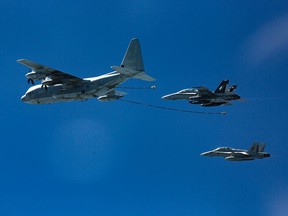 In this Oct. 13, 2016, photo provided by U.S. Marine Corps, two F/A-18D Hornets with Marine All-Weather Fighter Attack Squadron 533 approach a KC-130J with Marine Aerial Refueler Transport Squadron 352 during a Special Purpose Marine Air-Ground Task Force - Crisis Response - Central Command aerial refueling exercise in undisclosed location.  On Thursday, Dec. 6, 2018, two American warplanes crashed into the Pacific Ocean off Japan's southwestern coast after a midair collision,  and rescuers found one of the seven crew members in stable condition while searching for the others, officials said.  The U.S. Marine Corps said that the crash involved an F/A-18 fighter jet and a KC-130 refueling aircraft during regular training after the planes took off from their base in Iwakuni, near Hiroshima in western Japan.
