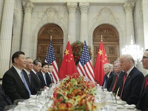 President Donald Trump, right, China's President Xi Jinping, left, and members of their delegations during their bilateral meeting at the G20 Summit, Saturday, Dec. 1, 2018 in Buenos Aires, Argentina.