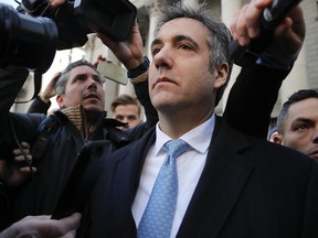 Michael Cohen walks out of federal court in New York on Nov. 29.