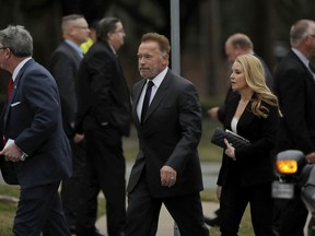 Former California Gov. Arnold Schwarzenegger arrives at a funeral for former President George H.W. Bush at St. Martin's Episcopal Church Thursday, Dec. 6, 2018, in Houston.