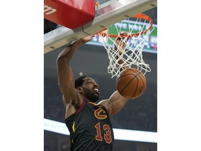 Cleveland Cavaliers' Tristan Thompson dunks during the first half of an NBA basketball game against the Milwaukee Bucks Monday, Dec. 10, 2018, in Milwaukee.