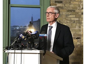 FILE - In this Dec. 2, 2018, file photo, Wisconsin Gov.-elect Tony Evers speaks at the Ward 4 building in Milwaukee. Evers said Sunday, Dec. 9, 2018, he's not optimistic that outgoing governor Scott Walker will veto bills approved by the Republican-dominated Legislature that would limit the new governor's power.