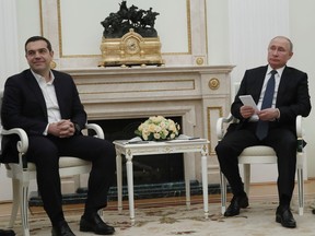 Greek Prime Minister Alexis Tsipras, left, and Russian President Vladimir Putin attend the talks in the Kremlin in Moscow, Russia, Friday, Dec. 7, 2018.