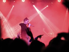 In this photo taken on Thursday, Nov. 29, 2018, Russian musician Nastya Kreslina, member of electronic duo called IC3PEAK performs during a concert in Yekaterinburg, Russia. In recent months, Russian artists have experienced a spike in pressure from the authorities, with a string of concert cancellations and arrests that have brought an outcry from critics who see it as the latest expression of censorship against Russian musicians.