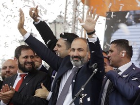 FILE - In this file photo taken on Tuesday, May 8, 2018, Armenian Prime Minister Nikol Pashinian gestures as he addresses the crowd in Republic Square in Yerevan, Armenia. Armenians are set to cast ballots in parliamentary elections expected to cement the incumbent prime minister's grip on power.