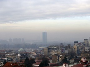 Fog and clouds blanket seen over Belgrade, Serbia, Friday, Dec. 7, 2018. The two-week U.N. climate meeting COP24 in Poland is intended to finalize details of the 2015 Paris accord on keeping average global temperature increases well below 2 degrees Celsius (3.6 Fahrenheit).