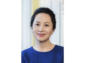 In this undated photo released by Huawei, Huawei's chief financial officer Meng Wanzhou is seen in a portrait photo. China on Thursday, Dec. 6, 2018, demanded Canada release the Huawei Technologies executive who was arrested in a case that adds to technology tensions with Washington and threatens to complicate trade talks. (Huawei via AP)