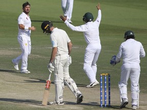 Pakistan's Yasir Shah celebrates dismissal of New Zealand's Will Sumerville in their test match in Abu Dhabi, United Arab Emirates, Thursday, Dec. 6, 2018.