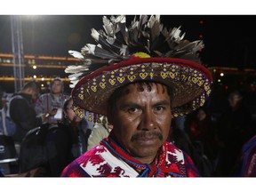 Indigenous leader Isidoro Montes poses for a photo at Mexico City's main square, the Zocalo, in Mexico City, Friday, June 30, 2018. Montes will take part in the the inauguration ceremony of Mexico's new president Andres Manuel Lopez Obrador on Saturday.