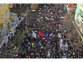 Albania University students protest outside the Education Ministry in Tirana, Tuesday, Dec. 11, 2018. Student demands include cutting tuition fees in half, doubling the budget for education and a greater student presence on decision-making boards.