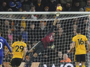 Wolverhampton's goalkeeper Rui Patricio makes a save during the English Premier League soccer match between Wolverhampton Wanderers and Chelsea at the Molineux Stadium in Wolverhampton, England, Wednesday, Dec. 5, 2018.