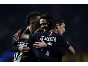 PSG forward Neymar celebrates with teammate Angel Di Maria, right, Edinson Cavani, second from right, after scoring his side' second goal during the Champions League group C soccer match between Red Star and Paris Saint Germain, in Belgrade, Serbia, Tuesday, Dec. 11, 2018.