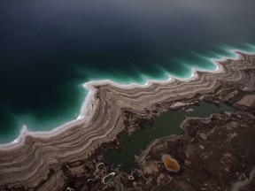 A file picture taken on November 10, 2011 shows an aerial view revealing sinkholes created by the drying of the Dead Sea, near Kibbutz Ein Gedi.