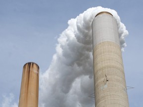 In this October 30, 2009 file photo smoke stacks at American Electric Power's (AEP) Mountaineer coal power plant are seen in New Haven, West Virginia.