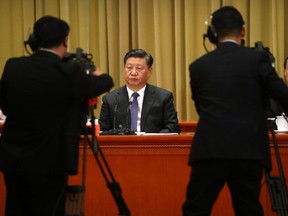 China's President Xi Jinping listens to a speech during an event to commemorate the 40th anniversary of the Message to Compatriots in Taiwan at the Great Hall of the People in Beijing on January 2, 2019.