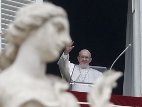 Pope Francis waves to the crowd gathered to attend the Angelus noon prayer he recited from the window of his studio overlooking St. Peter's Square, at the Vatican, Sunday, Jan. 20, 2019. Pope Francis has prayed for peace in Colombia after the Bogota bombing at a police academy. Francis told faithful in St. Peter's Square Sunday that he wanted to assure the Colombian people of his closeness after the "grave terrorist attack" on Jan. 17 that claimed 21 lives.