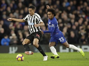 Newcastle United's Isaac Hayden, left, and Chelsea's Willian compete for the ball during the English Premier League soccer match between Chelsea and Newcastle United at Stamford Bridge stadium in London, Saturday, Jan. 12, 2019.