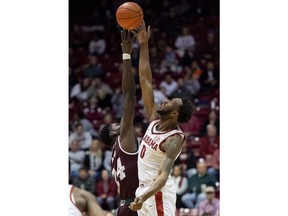 Alabama forward Donta Hall (0) wins the tip-off from Mississippi State forward Abdul Ado (24) during the first half of an NCAA college basketball game, Tuesday, Jan. 29, 2019, in Tuscaloosa, Ala.