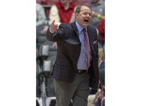 Mississippi head coach Kermit Davis yells in to his players against Alabama during the first half of an NCAA college basketball game, Tuesday, Jan. 22, 2019, in Tuscaloosa, Ala.