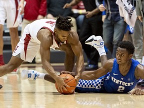 Kentucky guard Ashton Hagans (2) tries for a steal from Alabama guard Avery Johnson Jr. (5) during the first half of an NCAA college basketball game, Saturday, Jan. 5, 2019, in Tuscaloosa, Ala.
