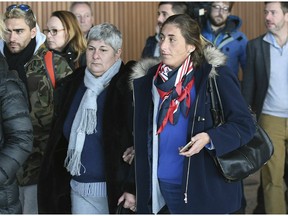 Emiliano Sala's mother Mercedes, left and sister Romina right,  arrive back at Guernsey airport after taking a flight to view the area of the English Channel in which the missing footballers plane was last seen, in Gurernsey, England, Monday, Jan. 28, 2019. Authorities said on Thursday they were no longer searching for the plane after a three-day air-and-sea operation near the Channel Islands failed to locate the aircraft, Argentine striker Sala or pilot David Ibbotson. A private search organised by the family has begun.