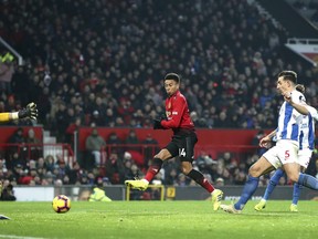 Manchester United's Jesse Lingard attempts a shot on goal, during the English Premier League soccer match between Manchester United and Brighton at Old Trafford, Manchester, England, Saturday, Jan. 19, 2019.