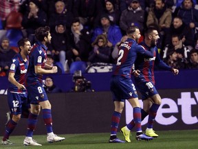 Levante defender Erick Cabaco, right , celebrates after scoring against Barcelona during the la Copa del Rey round of 16 first leg soccer match between Levante and Barcelona at the Ciutat de Valencia stadium in Valencia, Spain, Thursday Jan. 10, 2019.