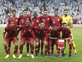 Qatar soccer team players pose for photographers during the AFC Asian Cup semifinal soccer match between United Arab Emirates and Qatar at Mohammed Bin Zayed Stadium in Abu Dhabi, United Arab Emirates, Tuesday, Jan. 29, 2019.