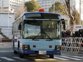 In this Tuesday, Jan. 8, 2019, file photo, a vehicle presumably carrying former Nissan chairman Carlos Ghosn leaves Tokyo Detention Center in Tokyo. Ghosn was getting his day in court to demand the reason for his prolonged detention by Tokyo authorities. The hearing Tuesday would be his first public appearance since his arrest on Nov. 19, 2018.