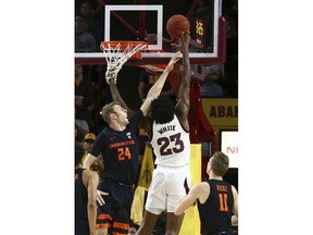 Arizona State forward Romello White (23) shoots over Oregon State forward Kylor Kelley (24) as Oregon State guard Zach Reichle (11) looks on during the first half of an NCAA college basketball game, Thursday, Jan. 17, 2019, in Tempe, Ariz.