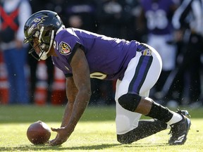 Baltimore Ravens quarterback Lamar Jackson recovers a fumble that he made in the first half of an NFL wild card playoff football game against the Los Angeles Chargers, Sunday, Jan. 6, 2019, in Baltimore.