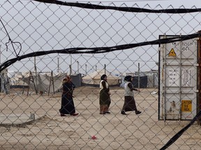 This Dec. 26, 2018 photo, shows displaced women in Bzeibiz camp, Anbar province, Iraq. A little over a year since the country fought its last battle against the Islamic State group, but well before it has gotten a handle on reconstruction, Iraq is closing its camps for the displaced and casting vulnerable families into a maelstrom of peril.