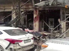 This frame grab from video provided by Hawar News, ANHA, the news agency for the semi-autonomous Kurdish areas in Syria, shows a damaged restaurant where an explosion occurred, in Manbij, Syria, Wednesday, Jan. 16, 2019. The Britain-based Syrian Observatory for Human Rights, a Syrian war monitoring group, and a local town council said Wednesday that the explosion took place near a patrol of the U.S.-led coalition and that there are casualties. (ANHA via AP)