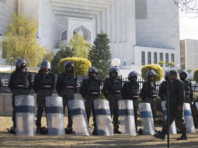 Pakistani troops surround the Supreme Court building as security is beefed up during the hearing of blasphemy case against Pakistani Christian woman Aasia Bibi, in Islamabad, Pakistan, Tuesday, Jan. 29, 2019. Pakistan's top court is to decide Tuesday whether to uphold its acquittal of the Christian woman sentenced to death for blasphemy, a move that would finally set her free and allow her to join her daughters, who have fled to Canada where they have been given asylum.