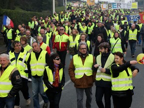 Yellow vest protesters demonstrate in Saint Jean De Luz, France, Saturday, Jan. 19, 2019. Yellow vest protesters are planning rallies in several French cities despite a national debate launched this week by President Emmanuel Macron aimed at assuaging their anger.