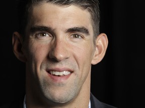 FILE - In this Oct. 25, 2016,  file photo, former Olympic swimmer Michael Phelps poses for a portrait in San Jose, Calif. Phelps is picking up more hardware _ this time for what he's been doing outside the pool. The Boston-based Ruderman Family Foundation, a leading voice in calling for more opportunities for the disabled, says the Olympic champion is the recipient of its fifth annual Morton E. Ruderman Award in Inclusion. The foundation tells The Associated Press it picked the world's most-decorated swimmer of all time to recognize his advocacy for people with disabilities and "his own journey with mental health."