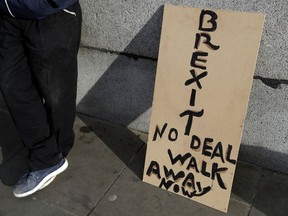 A banner leans on a wall near to parliament in London, Friday, Jan. 18, 2019. Talks to end Britain's Brexit stalemate appeared deadlocked Friday, with neither Prime Minister Theresa May nor the main opposition leader shifting from their entrenched positions.