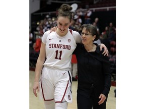 Stanford coach Tara VanDerveer, right, walks off the court after an NCAA college basketball game with Alanna Smith (11) after her 900th win at Stanford, defeating Washington State Sunday, Jan. 20, 2019, in Stanford, Calif.