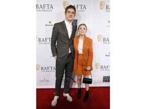 Bo Burnham, left, writer/director of the film "Eighth Grade," and the film's star Elsie Fisher pose together at the 2019 BAFTA Tea Party at the Four Seasons Hotel, Saturday, Jan. 5, 2019, in Los Angeles.