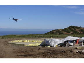 A small plane lands on Catalina's Airport in the Sky as the U.S. Marines and Navy Seabees rebuild the mountaintop runway on storied Santa Catalina Island, Calif., Friday, Jan. 25, 2019. About 100 Marines and sailors began working on the island this month under an agreement with the I Marine Expeditionary Force at Camp Pendleton, California, and the Catalina Island Conservancy. The work on Catalina's Airport in the Sky is paid for by $5 million donated to the nonprofit land trust.